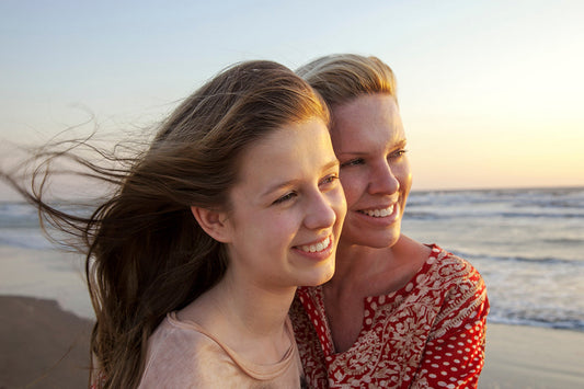 Perimenopausal mother spends time with daughter as she manages feelings around the loss of fertility