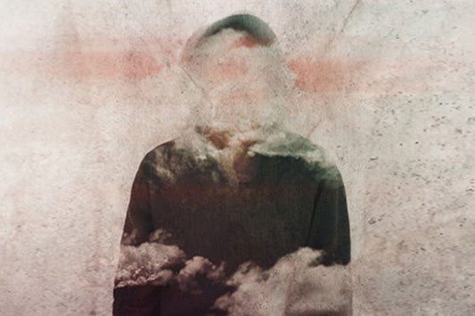 a person blurred by clouds depicting what it is like to live with menopause brain or brain fog