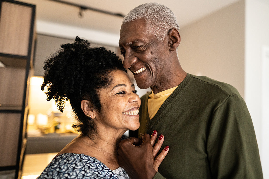 Couple sharing an intimate moment as they discuss managing painful sex in menopause