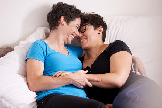 a couple hugging while discussing the connection between menopause and sex drive, including decreased orgasmic function, mood changes, and other menopause symptoms leading to lower interest in sex