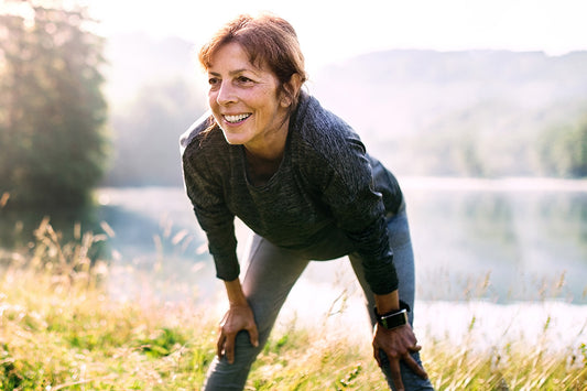 woman runs outdoors as a rhythmic exercise during menopause, an effective way of producing a relaxation response