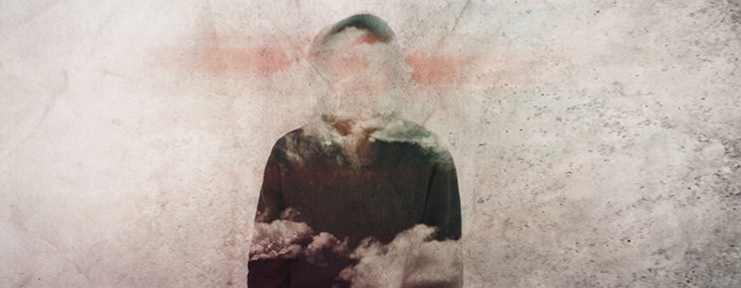 a person blurred by clouds depicting what it is like to live with menopause brain or brain fog