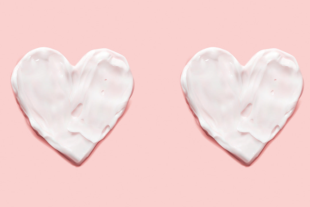 Three white hearts on a pink background to represent menopause and heart health