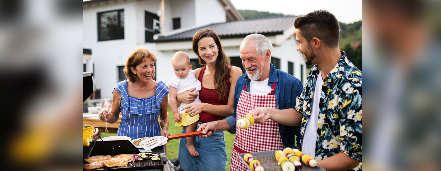 multigenerational family celebrating summer foods and grilling together