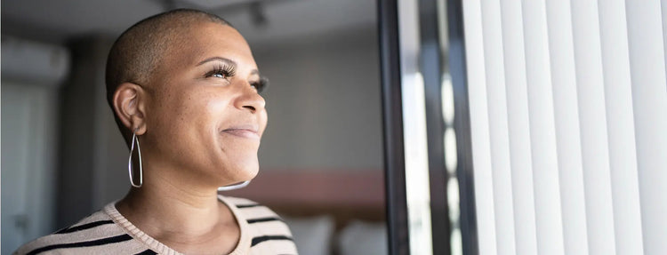 woman smiles after finding supplements for mood swings on Versalie