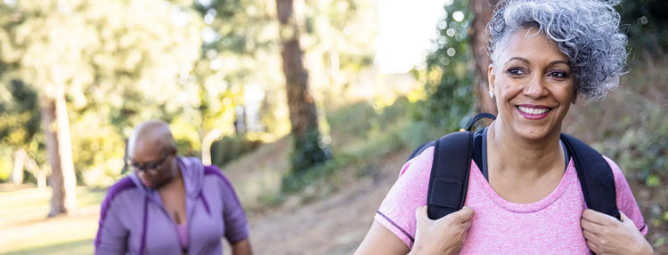 Two woman enjoying time outdoors after discovering menopause mobility support products on Versalie.com