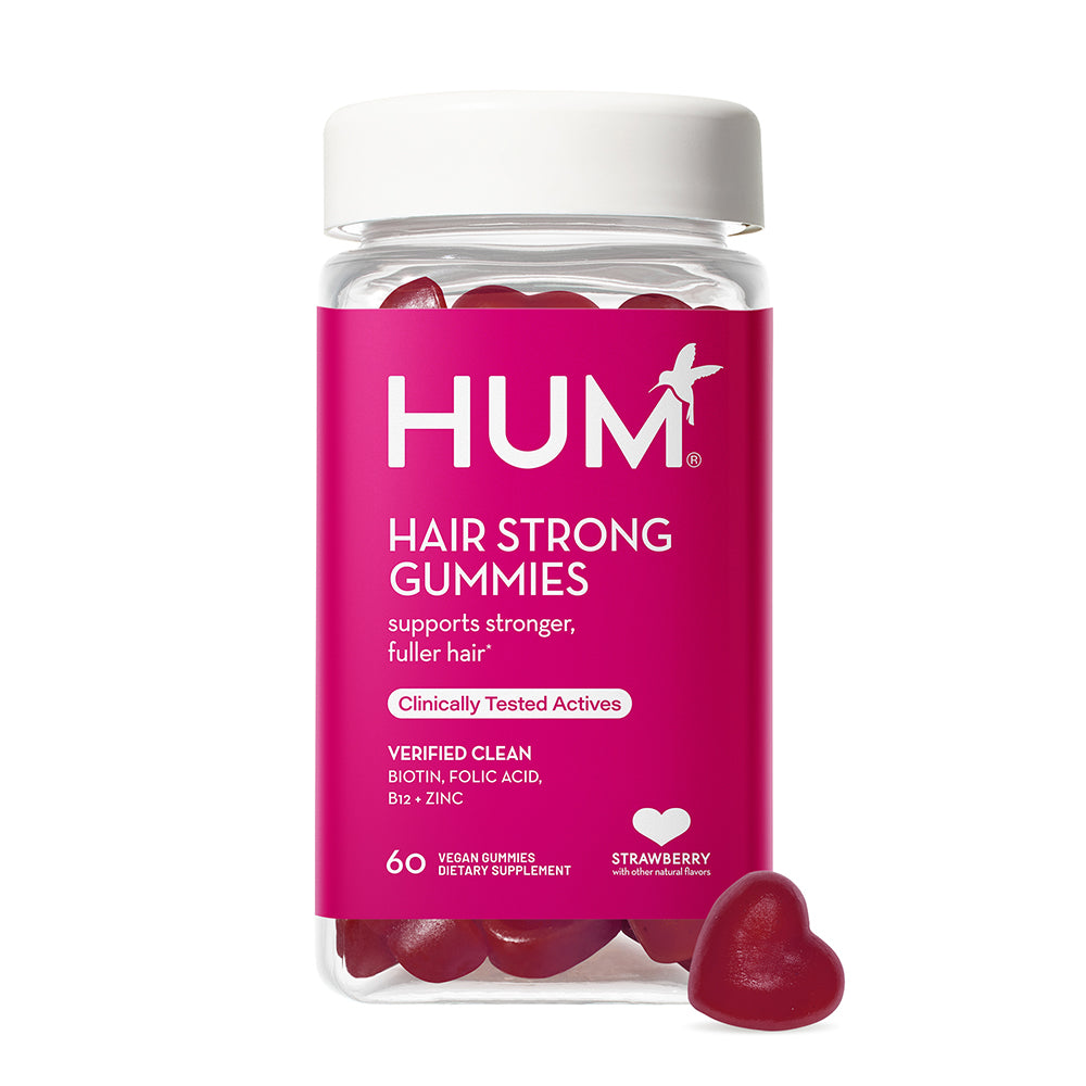 a bottle of HUM NUTRITION Hair Strong gummies, a dietary supplement that supports stronger, fuller hair