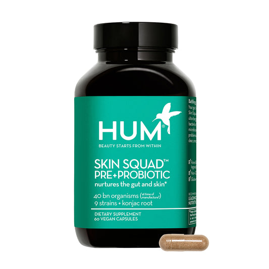 a bottle of HUM NUTRITION Skin Squad Pre+Probiotic capsules, a dietary supplement that nurtures the gut and skin