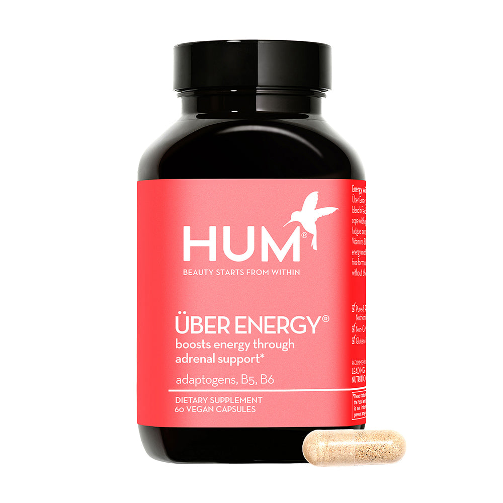 a bottle of HUM NUTRITION Uber Energy capsules, a dietary supplement that boosts energy through adrenal support