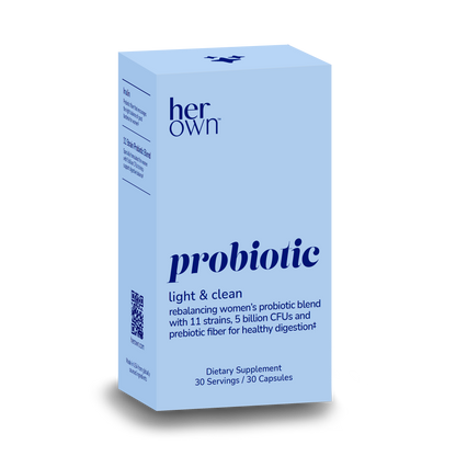 the front of a box of HER OWN Probiotic Supplement Light & Clean capsules, rebalancing women's probiotic blend with 11 strains, 5 billion CFUs and prebiotic fiber for healthy digestion