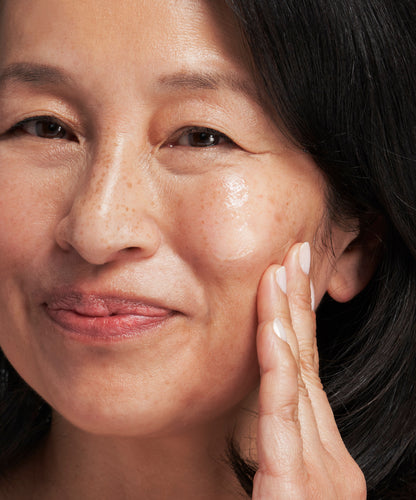 person putting NEOSTRATA Skin Active Firming Tri-Therapy Lifting Serum on their face